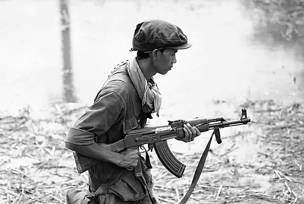 A Cambodian soldier carries his AK-47 rifle in 1970