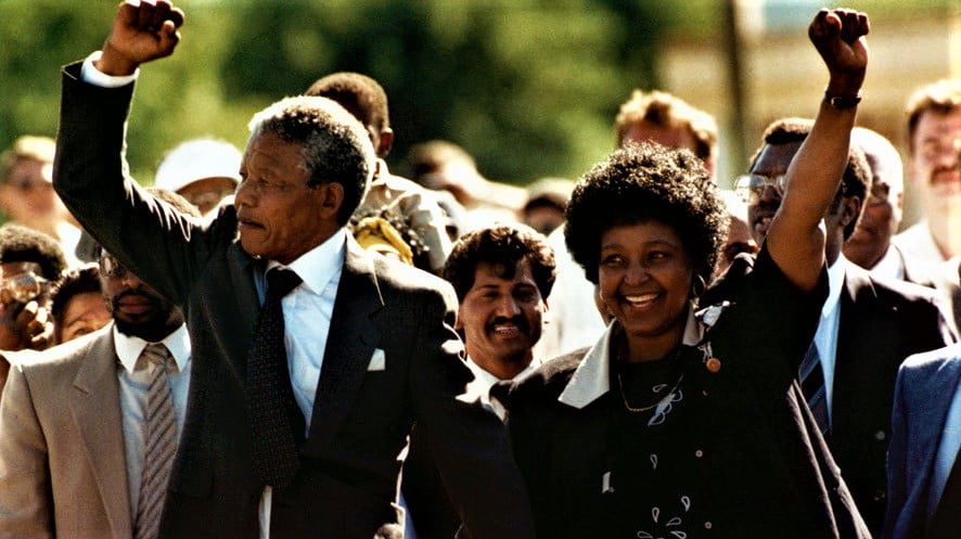 Nelson Mandela, with his wife, Winnie, walks to freedom after 27 years in prison on Feb. 11, 1990, in Cape Town.